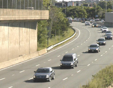 The procession passes: Senator Ted Kennedy's cortege passes by Savin Hill, Dorchester on the Southeast Expressway/I-93 on Thursday, Aug 27, 2009.