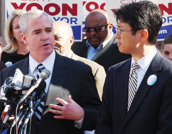 City Councillor At-Large Michael Flaherty, who is running for mayor against incumbent Thomas M. Menino, chats with Councillor Sam Yoon, who Flaherty says will be his deputy when the â€œticketâ€ defeats the mayor