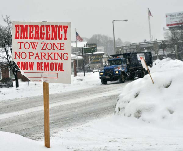 Snow Emergency: The city of Boston was under a snow emergency order for the third time in the new year this week, as a pair of winter storms swept through the region. Above, mounds of snow awaited removal at the corner of Granville Street and Gallivan Boulevard as the new batch of white stuff piled up on Tuesday morning. More than 60 inches of snow accumulated in Boston over the last month. Photo by Bill Forry