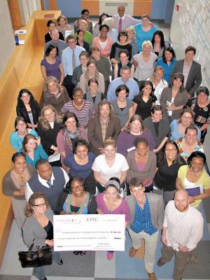 The faculty of Dorchester’s Neighborhood House Charter School  celebrate their Effective Practice Incentive Community (EPIC) award. Dorchester’s Boston Collegiate Charter School also won the award. 	Photo courtesy Dominic Slowey