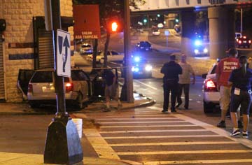 Deadly shooting on Columbia Road: Two people were shot to death in the car shown at left. Photo by Marcus DiPaola 
