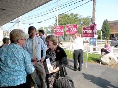 John O'Toole and Councillor Maureen Feeney greeted voters at Florian Hall on Tuesday.