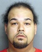 Shawn Young: Gun seized from his Topliff St. home has been linked to illegal 'straw' purchases in Georgia. 