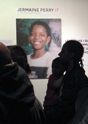 Anonymous Boston: Says Jerome Tevares, in silhouette, who lost his younger brother, Jermaine Perry, in December of 2008 in a shooting in Mattapan: “This exhibit is good for getting the word out.  … but the problems we face are above this. It’s bigger than this."