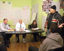 Gerry Scoppettuolo, right, making a point  during last Thursday’s meeting to discuss the possible closure of the post office in Uphams Corner. 
