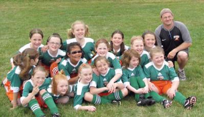 Derek McCleary : Dot coach poses with a U9 Hancock Striker team before the merger with the Boston Victory Soccer Club. Photo courtesy Derek McCleary
