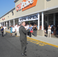 CW Price: Above, Sen. Jack Hart welcomed the retailer to Dorchester on Thursday morning. Photo by Ed Forry