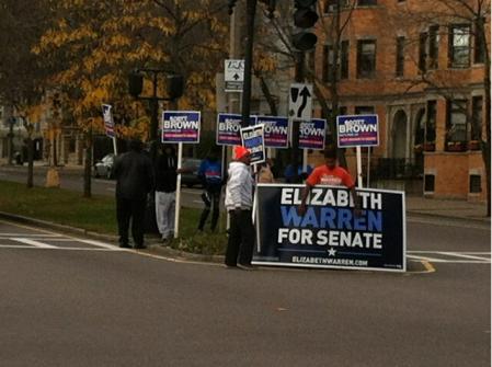 Brown, Warren supporters duel in Grove Hall: Friday morning standout drew a crowd.