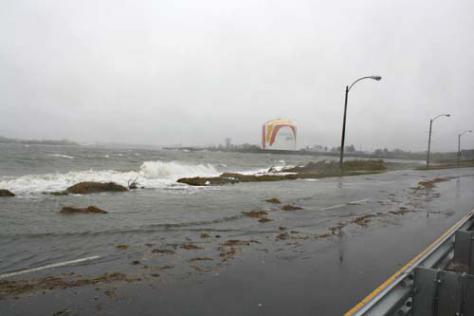 Swamped on the regular: Morrissey Boulevard, frequently closed, like last Friday, to traffic during high tides and storms could be modernized with new revenues from a proposed tax hike now being pushed by Governor Patrick. Above, the roadway during last fall’s hurricane. 	Photo by Devin M.