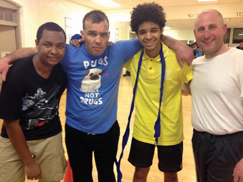 St. Peter's Boxing duo: Alvaro Monteiro, 16, former professional boxer Joey DeGrandis, Jucilino Barros, 17, and Stephen Doran, Boston Police Department Safe Street Team. Photo by Eoin Cannon