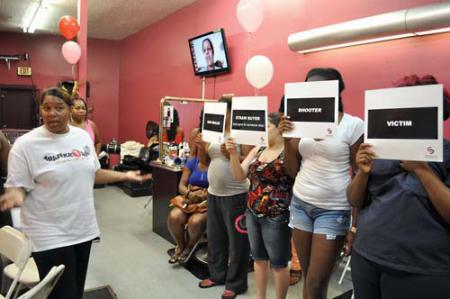 Operation Lipstick: Kim Odom gave a presentation on the role that straw purchases play in the illicit gun trade at Princey's hair salon in Codman Square. Photo by Bill Forry