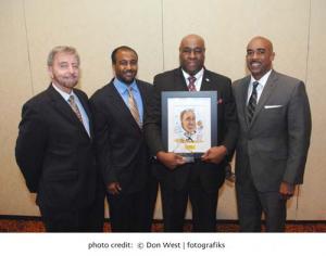 Michael Vance, ABCD Vice President, Field Operations, holds Ruth M. Batson Advocate of the Year Award from the Providers’ Council. (l-r) ABCD President/CEO John J. Drew; Vance’s son Nicholas Vance, Teen Director, Yawkey Club of Roxbury; Vance; and Michael Weekes, President &amp;amp;amp; CEO, Providers’ Council. 		Photo by Don West