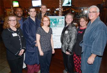 Evelyn Darling, center, has led the Fields Corner Main Street organization since 2005. She will leave the group this month to take a new role with Viet-AID. She is shown above with members of the Main Street’s board last November at their annual Dotini event at the Blarney Stone. Photo courtesy FCMS