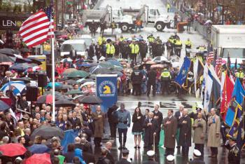 A flag-raising ceremony was held on Boylston Street on Tuesday afternoon. Among those on hand were the Richard family, former Mayor Tom Menino, Mayor Martin J. Walsh, Vice President Joseph Biden, Governor Deval Patrick, and BAA Director Tom Grilk. 	Photo: Jeremiah Robinson / Mayor’s Office