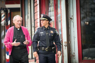 'Doc' Conway and Deputy Supt. Nora Baston walk along Bowdoin Street. Photo by Tom Kates Photography/BC High