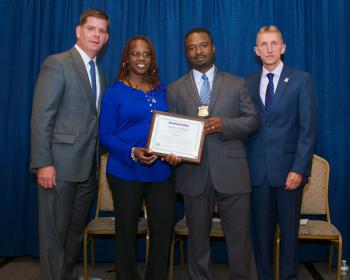 Patrick Champagnie and his wife Rhonda pose with Mayor Marty Walsh and Commissioner Evans at the Boston Police Department Promotional and Rating Ceremony at Florian Hall on Thursday.  Photo courtesy Sgt. Mike McCarthy