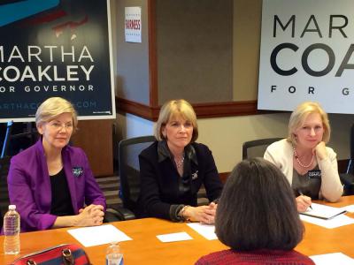 Sen. Elizabeth Warren, Attorney General Martha Coakley, and Sen. Kirsten Gillibrand listen as Marty Walz, president and CEO of Planned Parenthood Massachusetts and a former state representative, talks about growing up with parents who did not have paid sick time on Sunday afternoon in the SEIU offices in Dorchester.    Photo by Lauren Dezenski
