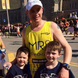 Returning for second year: Patrick Brophy was shown after finishing last year's marathon for Team MR8 with sons Finbarr and Patrick.