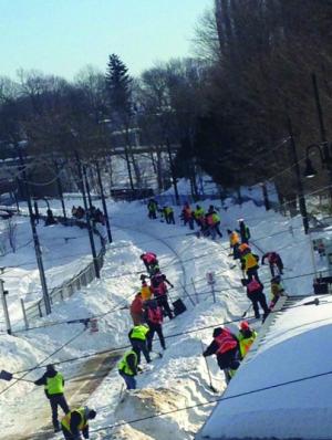Mattapan Line: Workers labored to clear the Mattapan trolley tracks near Milton station over the weekend. Service resumed on the trolley line on Monday after weeks of being off-line due to snow and ice. Photo courtesy Ellen Berlin 