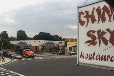 Crossroads of Adams, Granite and Gallivan: The old China Sky sign looms over the intersection. Across the street, an empty video store awaits a new tenant— a restaurant and bar that will be called Sam Maverick's. 