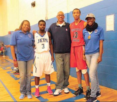 Anitra Nance (left) posed at halftime with the team captain from East Boston High, Ke’andre Henderson, Mike Rubin, Terrel Williams, captain of Bridgewater Raynham, and Shai-Ann Nance.