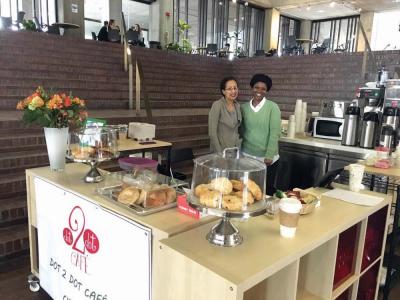 Karen Henry-Garrett, left, stands with an employee in the new Dot2Dot Cafe coffee stand in City Hall. Jennifer Smith photo