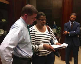 Mayor Walsh meets with Liz Gomes: The mayor's Chief of Education Rahn Dorsey watches at right. Maddie Kilgannon photo