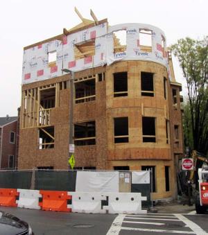 Under construction on Savin Hill Avenue: New housing units are easing the burden on older housing stock, according to city officials. Jennifer Smith photo