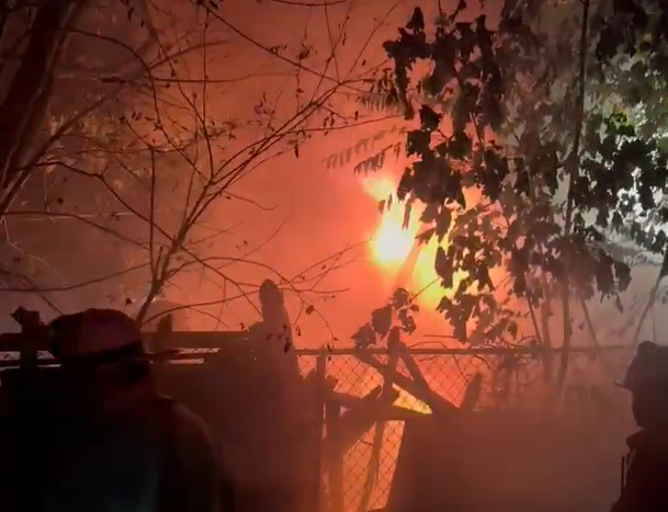 Fire coming out of basement of house on Dorchester Avenue.