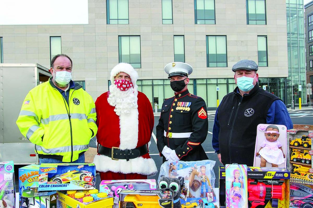 Local 537 Business Manager Tom Kerr, Santa Claus, Marine vet and Inside Guard Danny O'Brien, and Organizer Chris Brennan with toy donations.[2][1].jpg