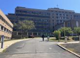 People walked up to the shuttered Carney Hospital on Sept. 3. Alison Kuznitz photo/ SHNS