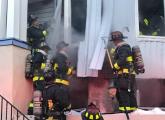 Boston firefighters on Barry Street.